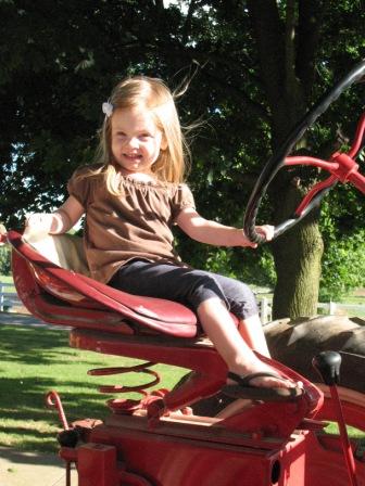 Grace on Her Great Grandpa's Tractor